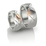 Duo d'Alliances Cœur Scellé de Jocelyn Bouget : paire d'alliances en or ou argent, modélisation 3D, fonte et finition par le joaillier Laurent Barateau (Reims). Pièce d'exception sur commande.