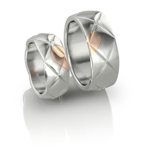Duo d'Alliances Cœur Scellé de Jocelyn Bouget : paire d'alliances en or ou argent, modélisation 3D, fonte et finition par le joaillier Laurent Barateau (Reims). Pièce d'exception sur commande.